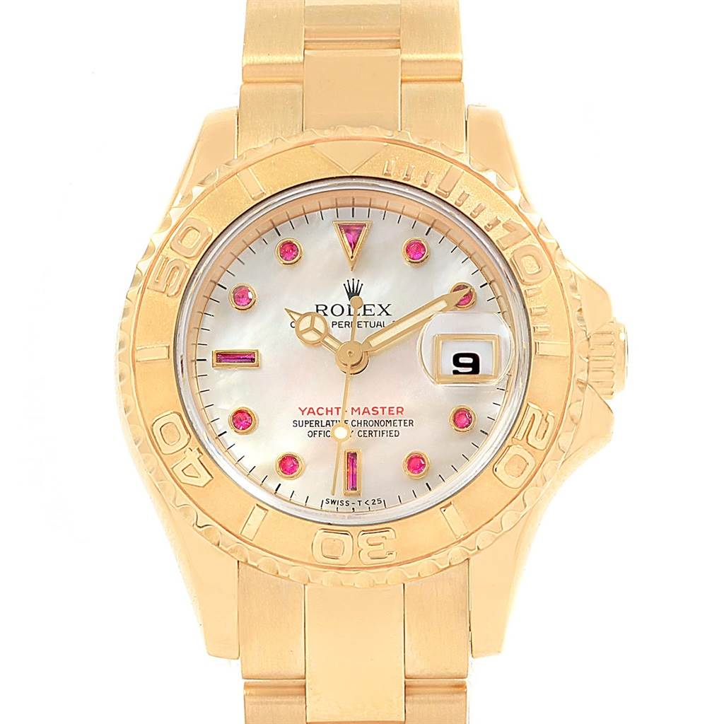 This Rolex Yacht-Master 69628 Women's Yellow Gold Mother of Pearl Dial 69628 Women's Yellow Gold Mother of Pearl Dial watch is shown from a front angle, highlighting its gold case, bezel, bracelet, and mother-of-pearl dial with ruby hour markers.