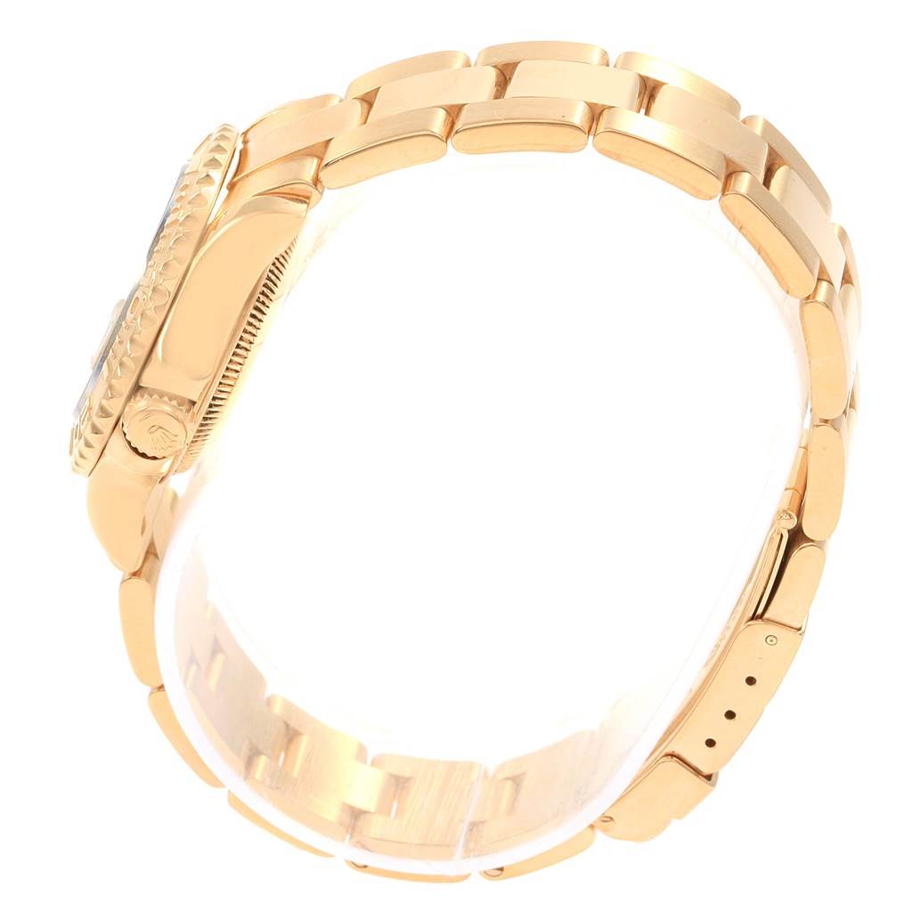 This image shows a side view of the Rolex Yacht-Master 69628 Women's Yellow Gold Mother of Pearl Dial 69628 Women's Yellow Gold Mother of Pearl Dial watch, highlighting its gold bracelet and case.