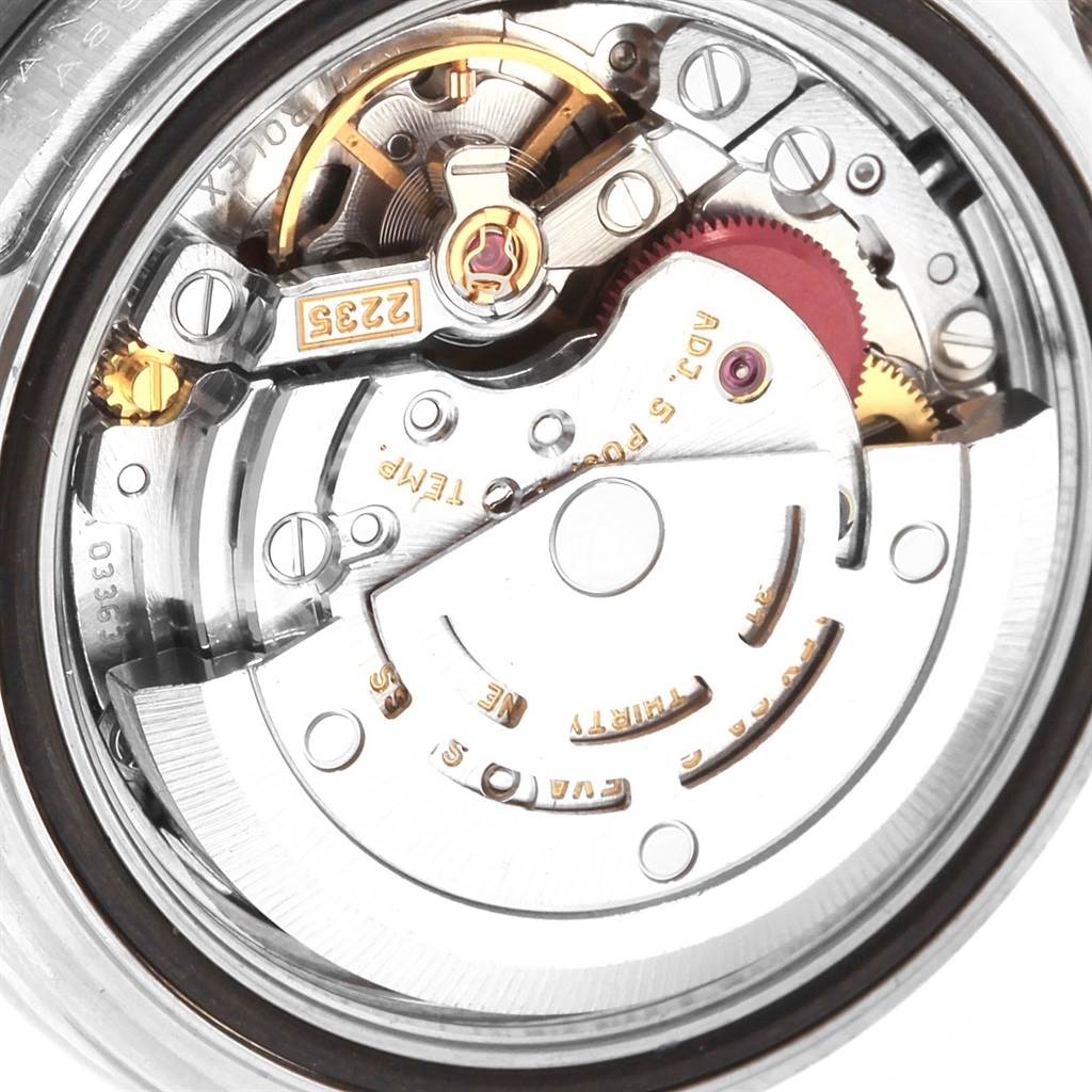 The image shows a close-up of the internal mechanism of a Rolex Yacht-Master 169622 Women's Stainless Steel Silver Dial 169622 Women's Stainless Steel Silver Dial watch, highlighting gears and the rotor.