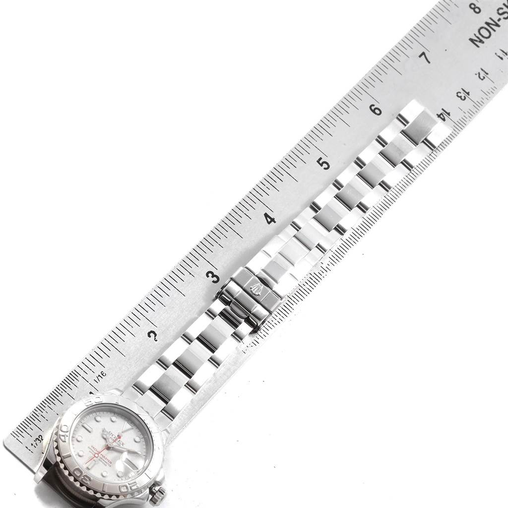 The image shows a top-down view of a Rolex Yacht-Master 169622 Women's Stainless Steel Silver Dial 169622 Women's Stainless Steel Silver Dial watch next to a measuring ruler.