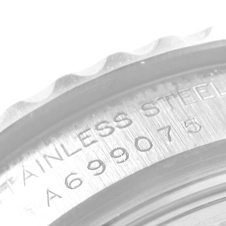This close-up image shows the engraved stainless steel casing of a Rolex Yacht-Master 169622 Women's Stainless Steel Silver Dial 169622 Women's Stainless Steel Silver Dial watch.