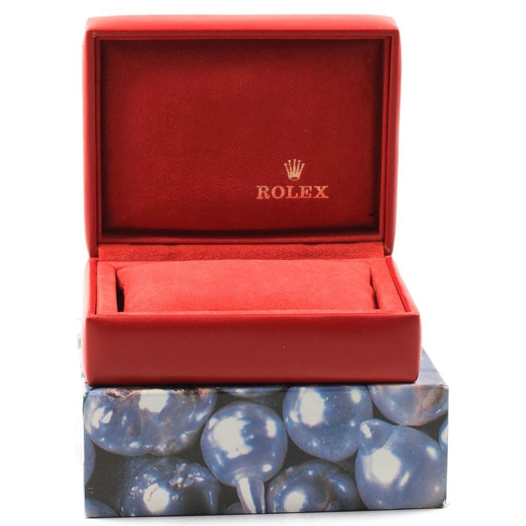 This image shows an open, red Rolex box for the Yacht-Master model, with the logo and brand name visible inside the lid.