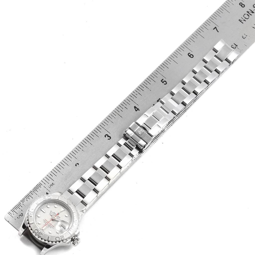 The image shows a Rolex Yacht-Master 169622 Women's Stainless Steel Silver Dial 169622 Women's Stainless Steel Silver Dial watch positioned next to a ruler, displaying the dial and metal bracelet.