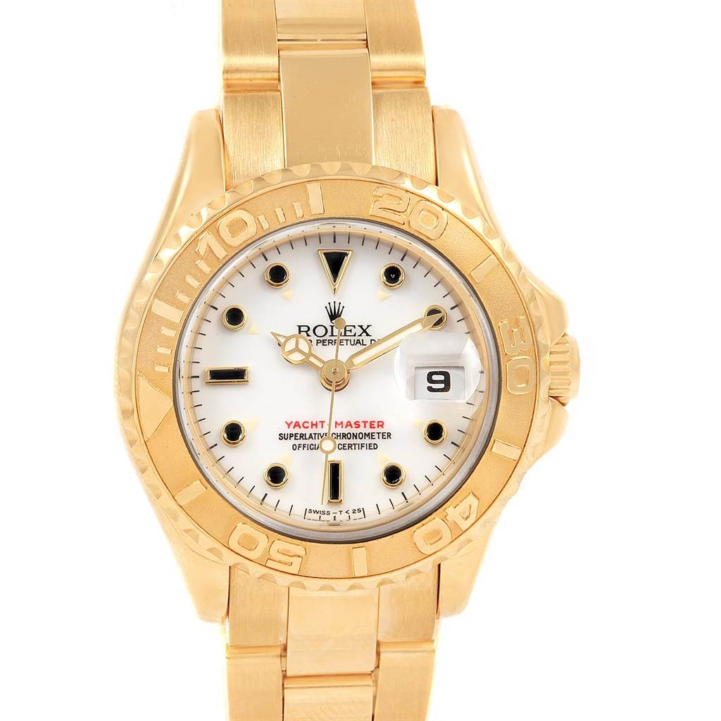The image shows a head-on view of a gold Rolex Yacht-Master 69628 Women's Yellow Gold White Dial 69628 Women's Yellow Gold White Dial watch, detailing the dial, bezel, and bracelet.