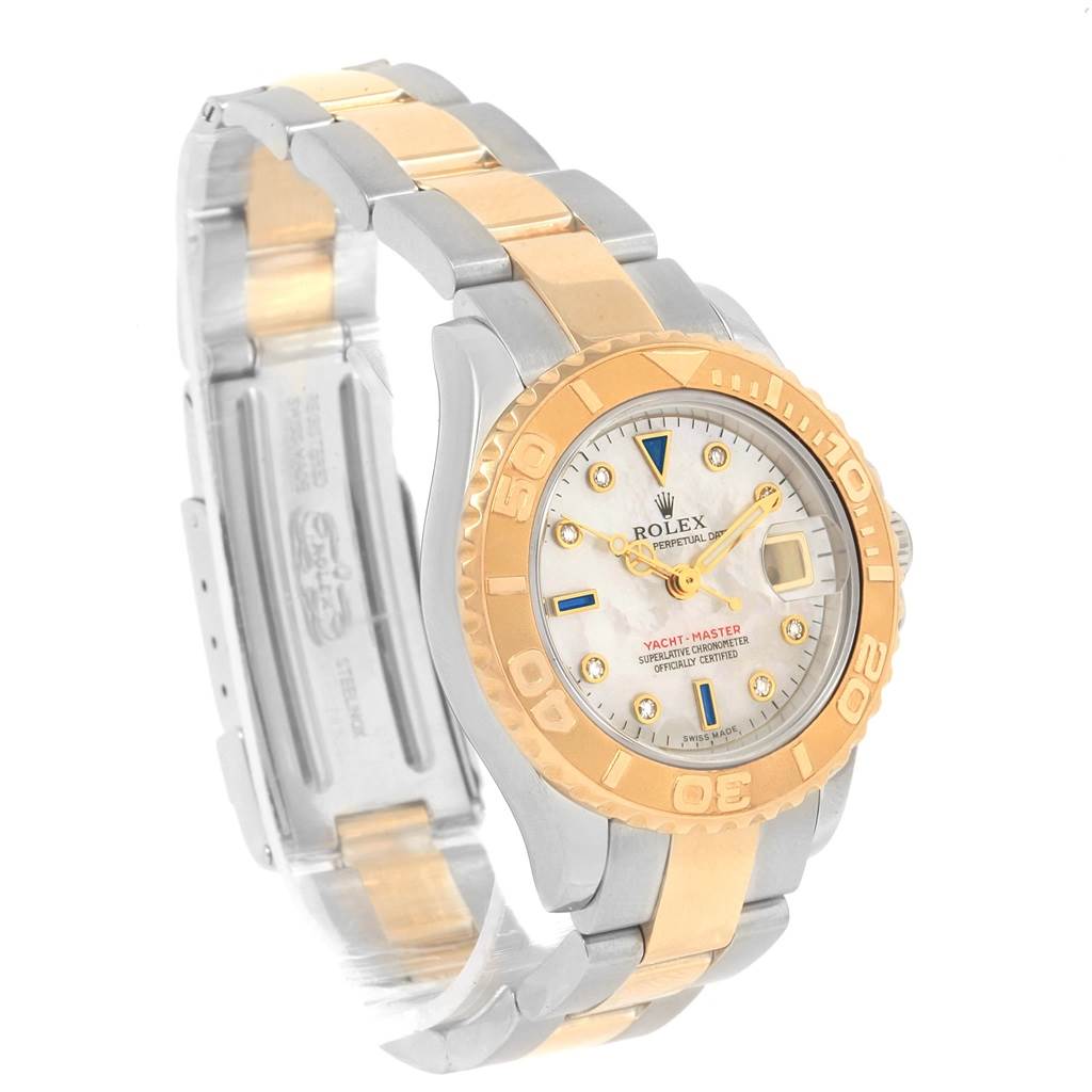 The image shows a Rolex Yacht-Master 169623 Women's Steel and Gold (two tone) Mother of Pearl Dial 169623 Women's Steel and Gold (two tone) Mother of Pearl Dial watch at an angle displaying the face, bezel, and part of the bracelet.