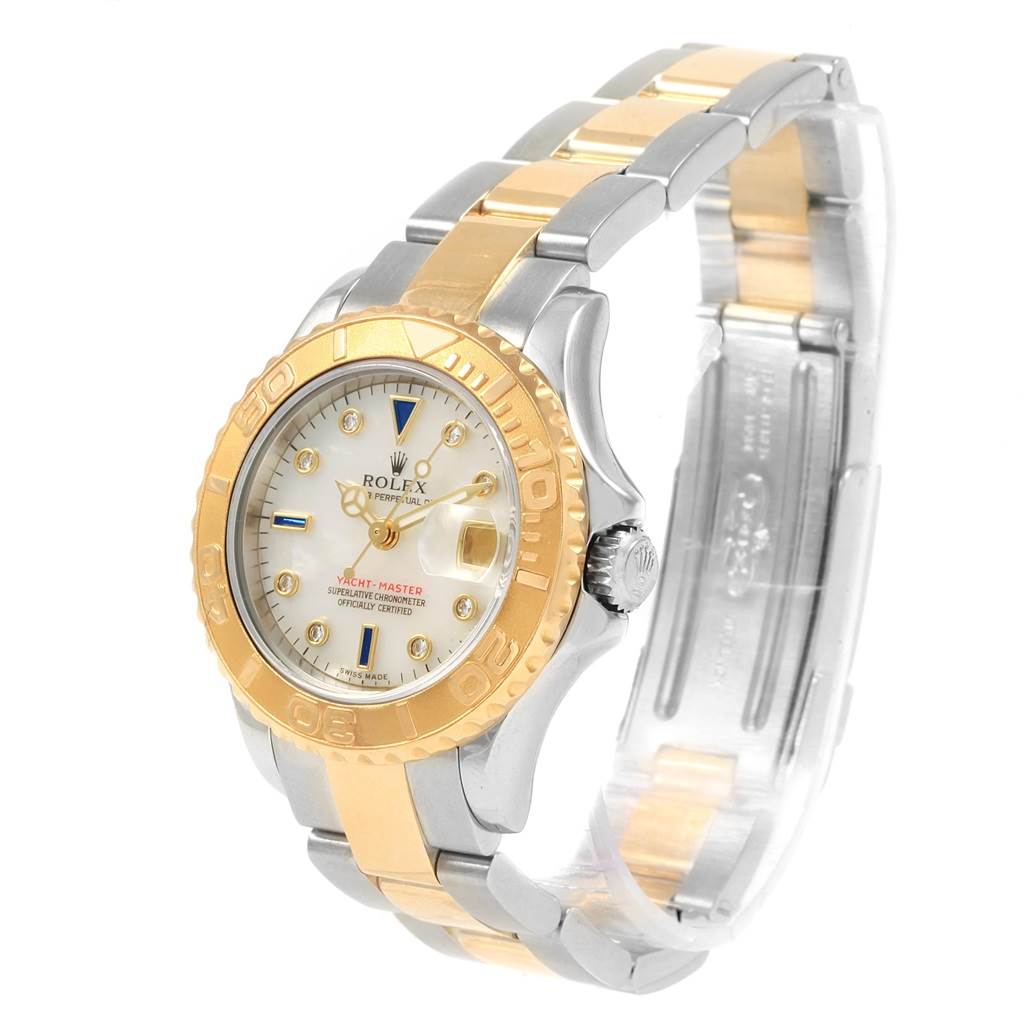 This image shows a Rolex Yacht-Master 169623 Women's Steel and Gold (two tone) Mother of Pearl Dial 169623 Women's Steel and Gold (two tone) Mother of Pearl Dial watch at an angle, displaying the face, bezel, and part of the bracelet.