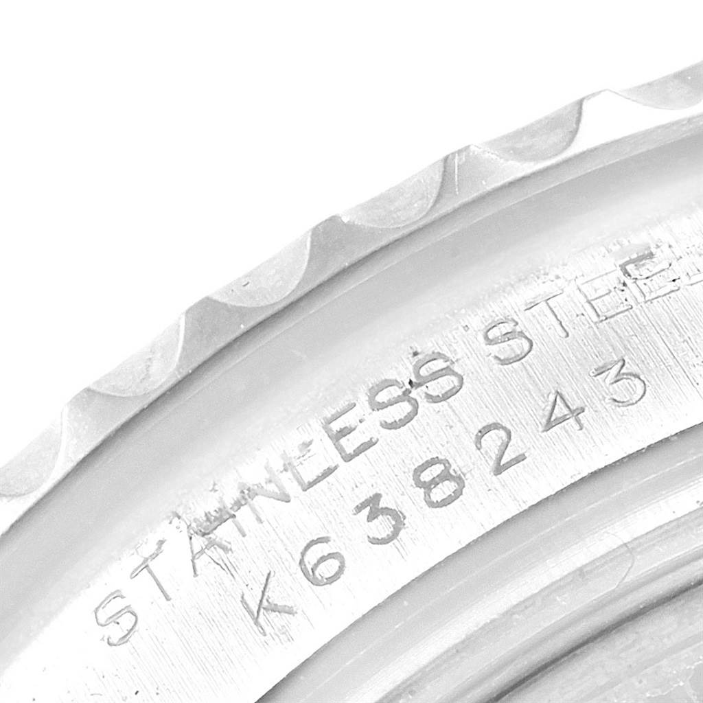 This image shows the engraved stainless steel part of the bezel and case of a Rolex Yacht-Master 169622 Women's Stainless Steel Silver Dial 169622 Women's Stainless Steel Silver Dial watch.