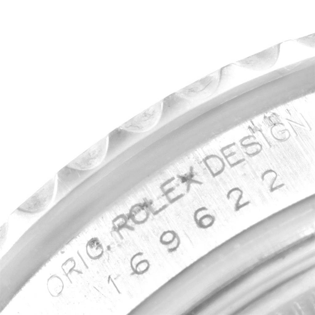 The image shows a close-up of the bezel and part of the engraved case of a Rolex Yacht-Master 169622 Women's Stainless Steel Silver Dial 169622 Women's Stainless Steel Silver Dial watch.