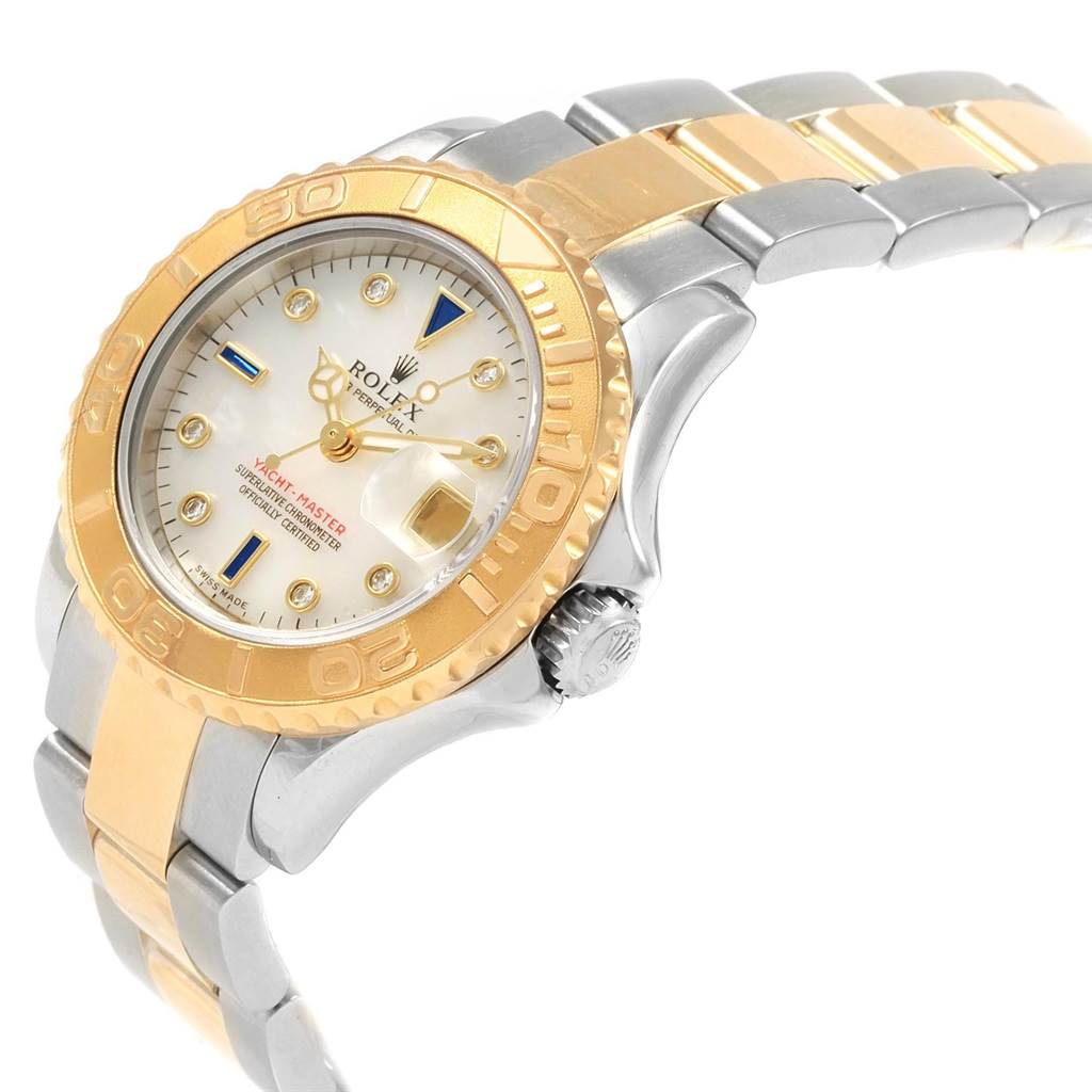 The Rolex Yacht-Master 169623 Women's Steel and Gold (two tone) Mother of Pearl Dial 169623 Women's Steel and Gold (two tone) Mother of Pearl Dial watch is shown at a tilted angle showcasing its face, bezel, crown, and two-tone bracelet.