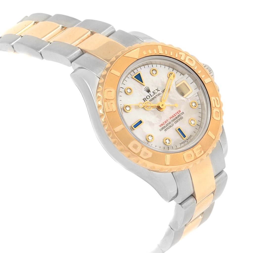 The image shows a side-angle view of a Rolex Yacht-Master 169623 Women's Steel and Gold (two tone) Mother of Pearl Dial 169623 Women's Steel and Gold (two tone) Mother of Pearl Dial watch, highlighting its dial, bezel, and two-tone metal bracelet.
