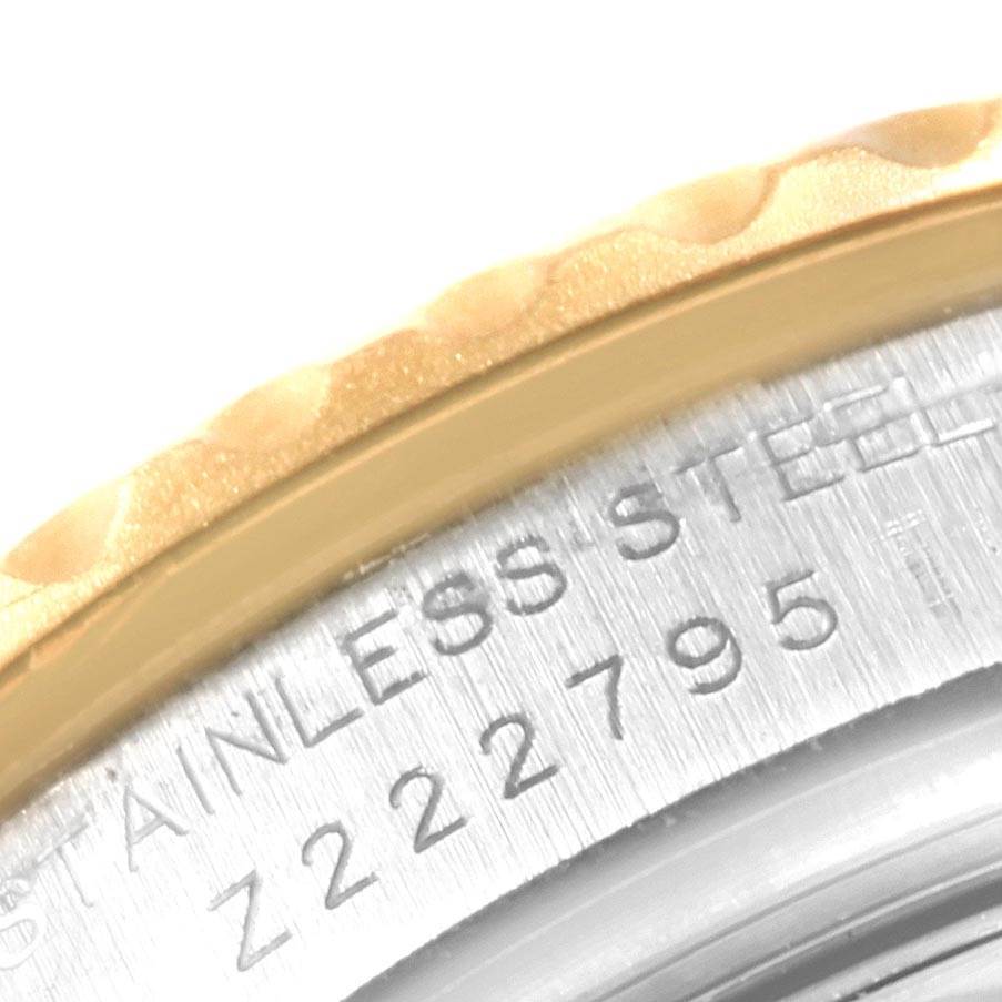 The image shows a close-up of the bezel and part of the case with engraved details of the Rolex Yacht-Master 169623 Men
s Steel and Gold (two tone) Grey Dial 169623 Men
s Steel and Gold (two tone) Grey Dial watch.