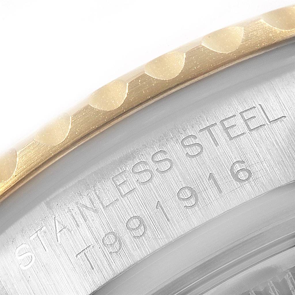This image shows a close-up of the bezel and engraved case back of a Rolex Yacht-Master 69623 Women's Steel and Gold (two tone) Grey Dial 69623 Women's Steel and Gold (two tone) Grey Dial watch.