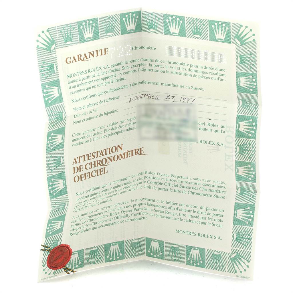 The image shows a folded warranty certificate for a Rolex Yacht-Master 69623 Women's Steel and Gold (two tone) Grey Dial 69623 Women's Steel and Gold (two tone) Grey Dial watch, featuring typical Rolex insignia and official language.