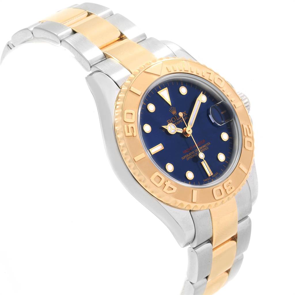 The image shows a Rolex Yacht-Master 168623 Men
s Steel and Gold (two tone) Blue Dial 168623 Men
s Steel and Gold (two tone) Blue Dial watch at an angle highlighting the face, bezel, and two-tone bracelet.