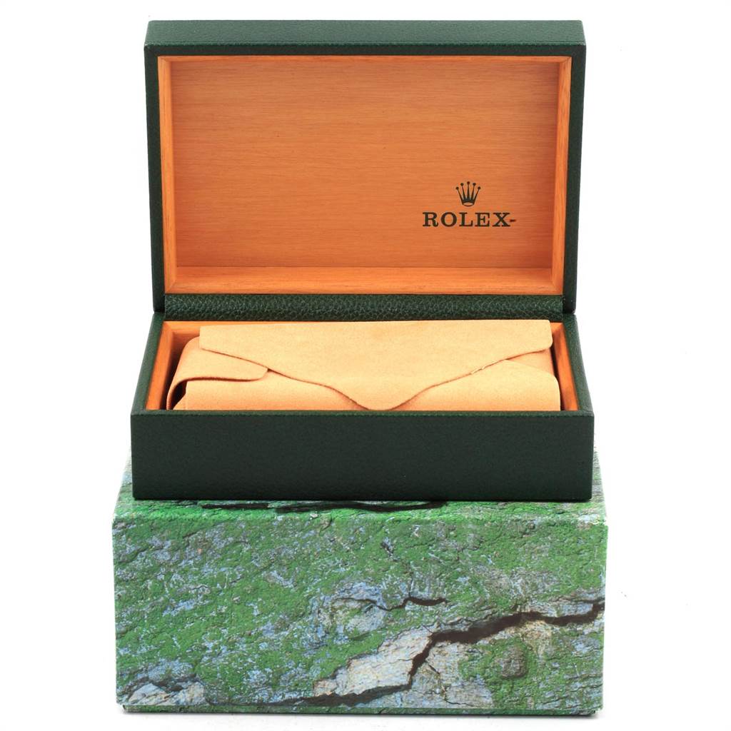 The image shows an open green and wooden Rolex watch box, with an interior envelope, for the Yacht-Master model.