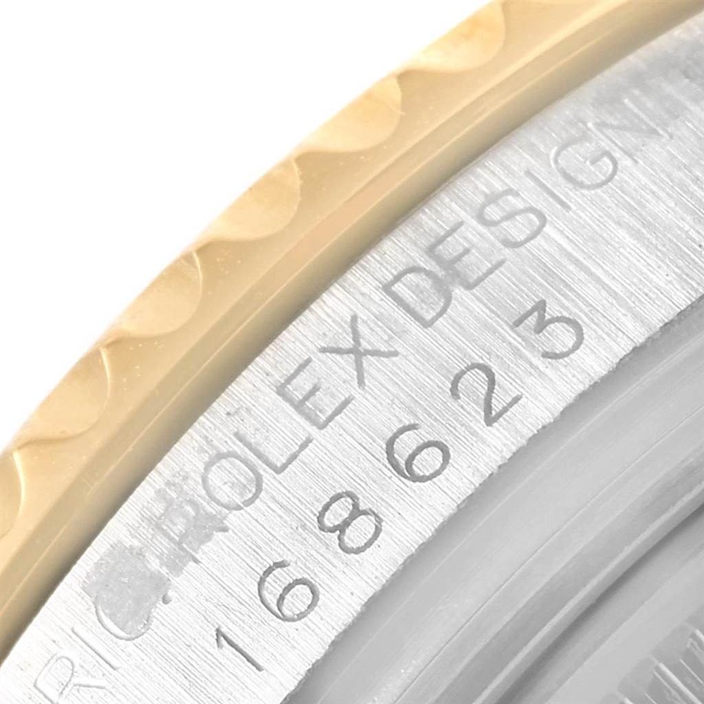 This close-up image shows the side of the Rolex Yacht-Master 168623 Men
s Steel and Gold (two tone) Blue Dial 168623 Men
s Steel and Gold (two tone) Blue Dial
s bezel and case with the model number visible.