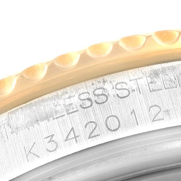 This close-up image shows the edge of the bezel and part of the case back of the Rolex Yacht-Master 168623 Men
s Steel and Gold (two tone) Blue Dial 168623 Men
s Steel and Gold (two tone) Blue Dial model.