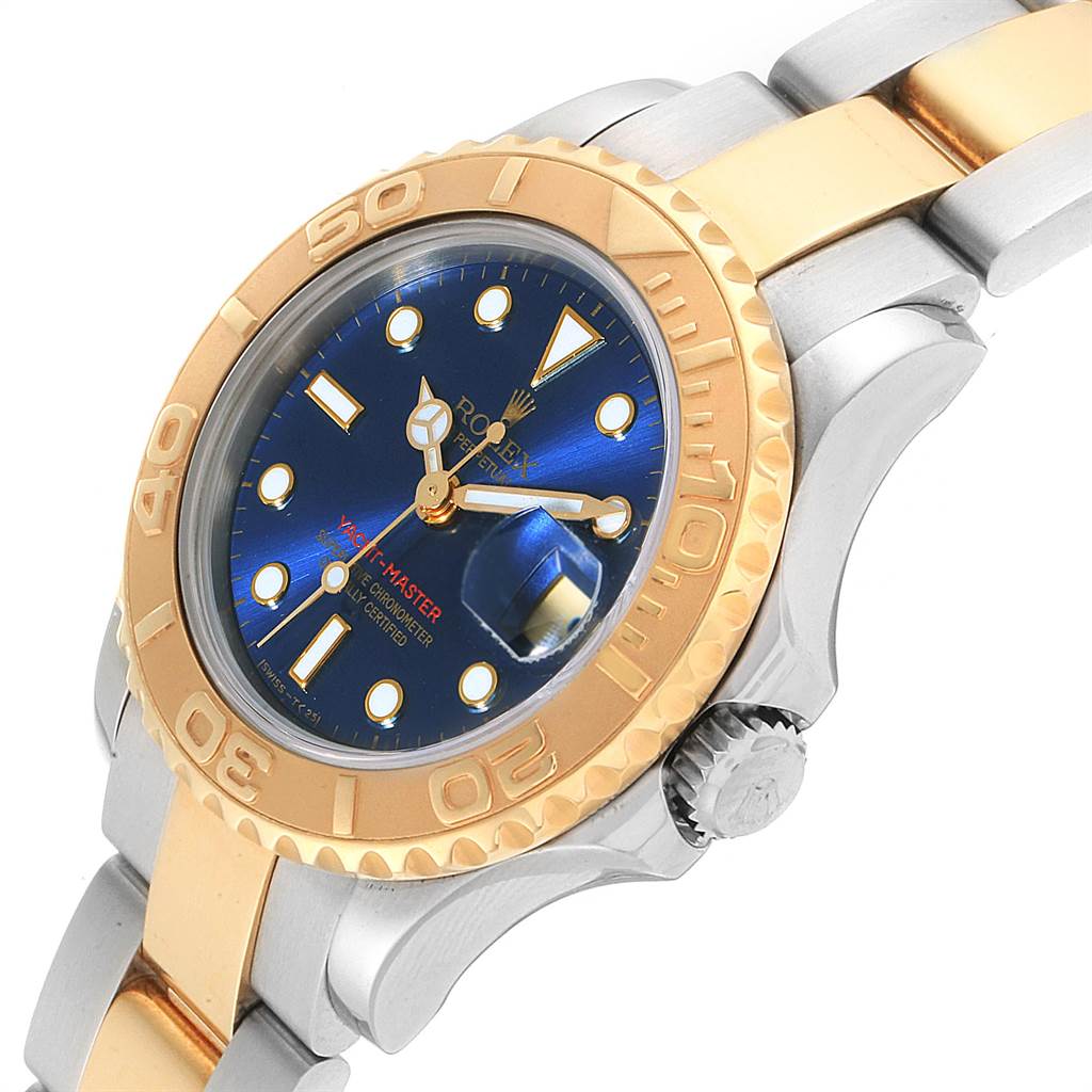 This Rolex Yacht-Master 69623 Women's Steel and Gold (two tone) Blue Dial 69623 Women's Steel and Gold (two tone) Blue Dial watch is shown at an angled close-up, highlighting its bezel, dial, and part of the bracelet.