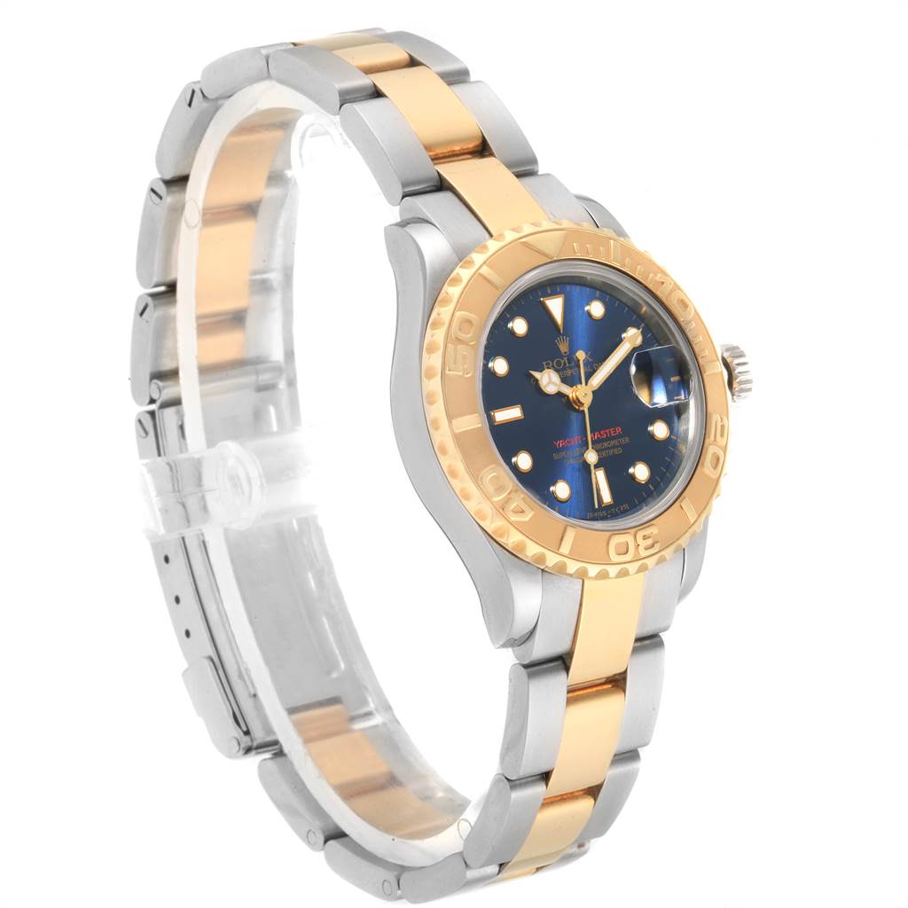The Rolex Yacht-Master 69623 Women's Steel and Gold (two tone) Blue Dial 69623 Women's Steel and Gold (two tone) Blue Dial watch is shown from a side angle, displaying its two-tone band, bezel, and blue dial.