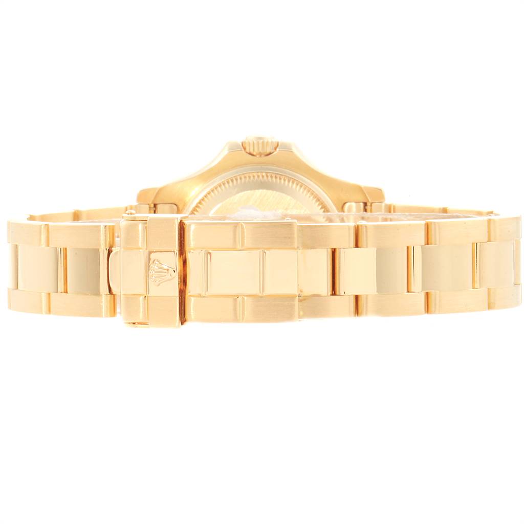 This image shows the back of the Rolex Yacht-Master 169628 Women's Yellow Gold White Dial 169628 Women's Yellow Gold White Dial watch with its gold bracelet and clasp.
