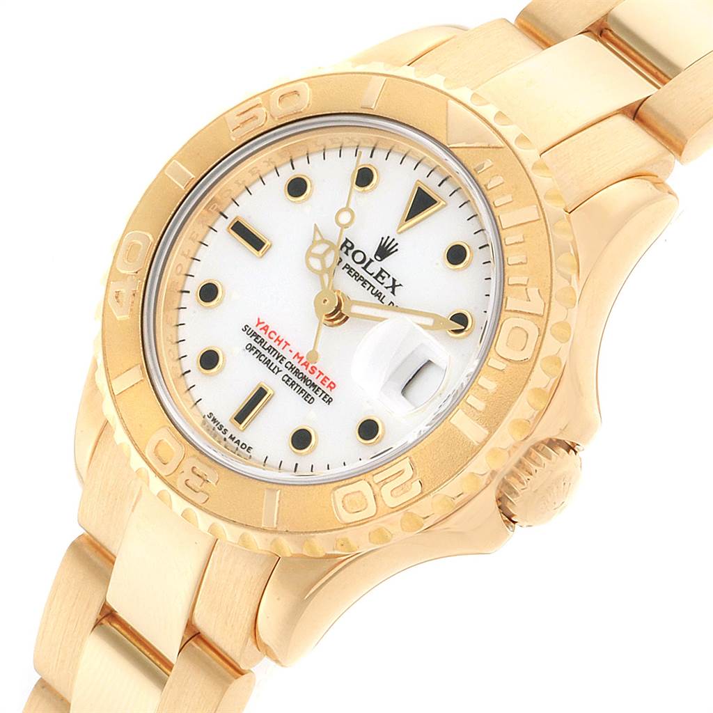 This image shows a Rolex Yacht-Master 169628 Women's Yellow Gold White Dial 169628 Women's Yellow Gold White Dial watch at an angle displaying the face, bezel, crown, and part of the bracelet.