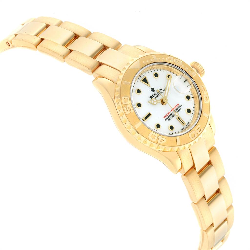 The image shows a Rolex Yacht-Master 169628 Women's Yellow Gold White Dial 169628 Women's Yellow Gold White Dial watch at an angled view, highlighting its gold bracelet, bezel, and white dial.
