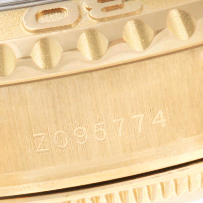 The image shows a close-up angle of the bezel and serial number area of a Rolex Yacht-Master 169628 Women's Yellow Gold White Dial 169628 Women's Yellow Gold White Dial watch.