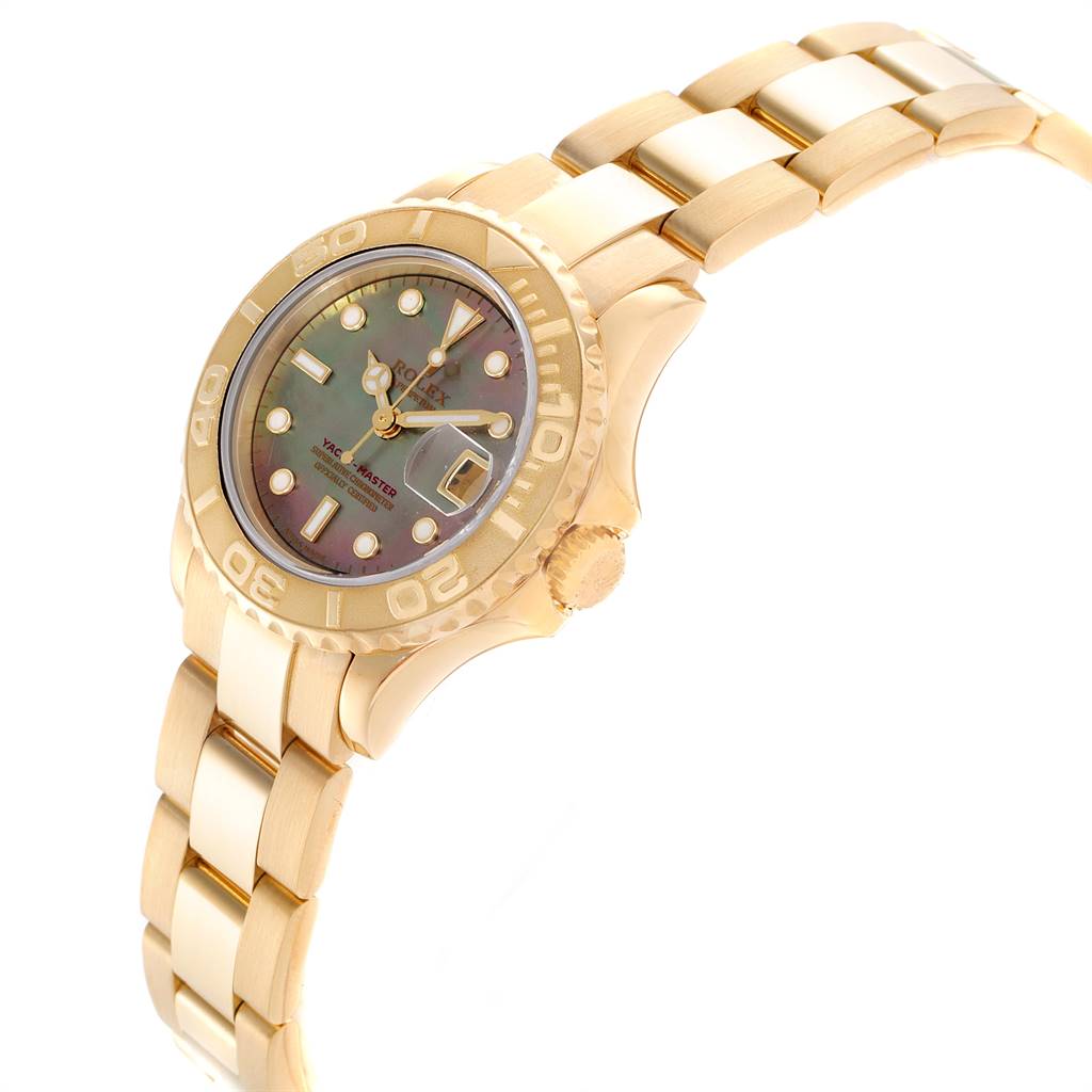 The image shows an angled view of a Rolex Yacht-Master 169628 Women's Yellow Gold Mother of Pearl Dial 169628 Women's Yellow Gold Mother of Pearl Dial watch, highlighting the watch face, bezel, crown, and bracelet.