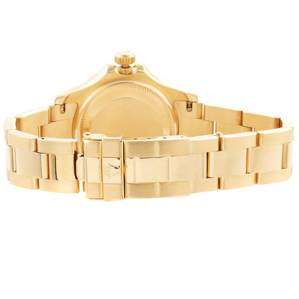 The image shows the back view of the Rolex Yacht-Master 169628 Women's Yellow Gold Mother of Pearl Dial 169628 Women's Yellow Gold Mother of Pearl Dial watch focusing on the clasp and metal bracelet.