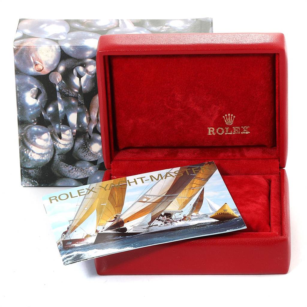 The image shows an empty red Rolex Yacht-Master 169623 Steel and Gold (two tone) White Dial 169623 Steel and Gold (two tone) White Dial watch box and an instruction manual, viewed from the front.