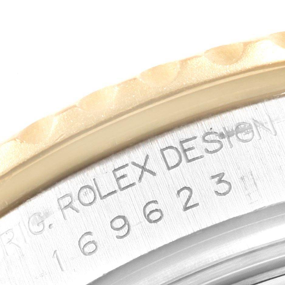 Close-up angle focusing on the engraved bezel and case-back of the Rolex Yacht-Master 169623 Steel and Gold (two tone) White Dial 169623 Steel and Gold (two tone) White Dial.