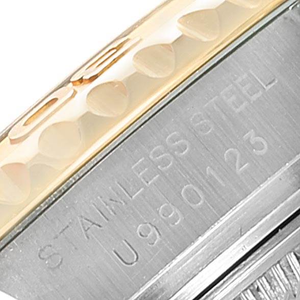 This image shows a close-up of the bezel and case of a Rolex Yacht-Master 169623 Steel and Gold (two tone) White Dial 169623 Steel and Gold (two tone) White Dial watch, highlighting the stainless steel and bezel markings.