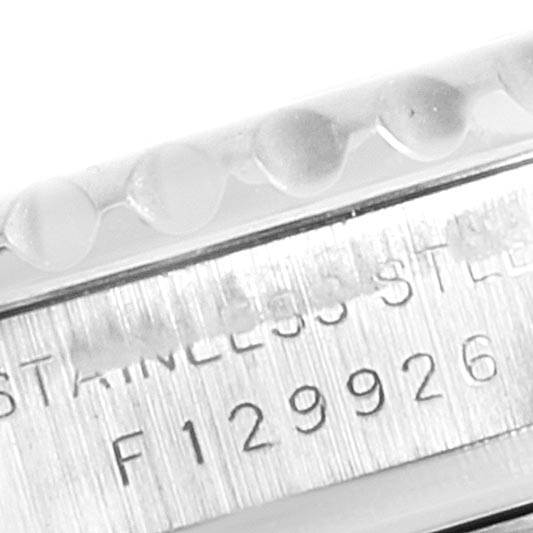 The image shows a close-up of the engraving on the side of a Rolex Yacht-Master 169622 Women's Stainless Steel Silver Dial 169622 Women's Stainless Steel Silver Dial watch, indicating stainless steel and a serial number.