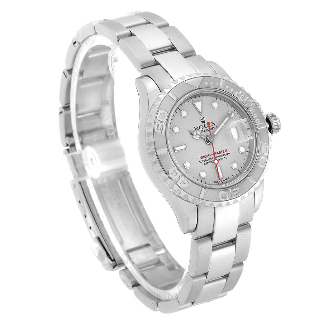 The Yacht-Master Rolex watch is shown at a slight angle, highlighting its face, bezel, and bracelet.