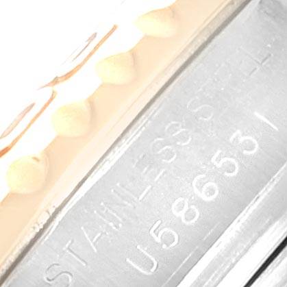 This close-up image shows the side of a Rolex Yacht-Master 169623 Women's Steel and Gold (two tone) White Dial 169623 Women's Steel and Gold (two tone) White Dial watch, focusing on the stainless steel material and serial number engraving.