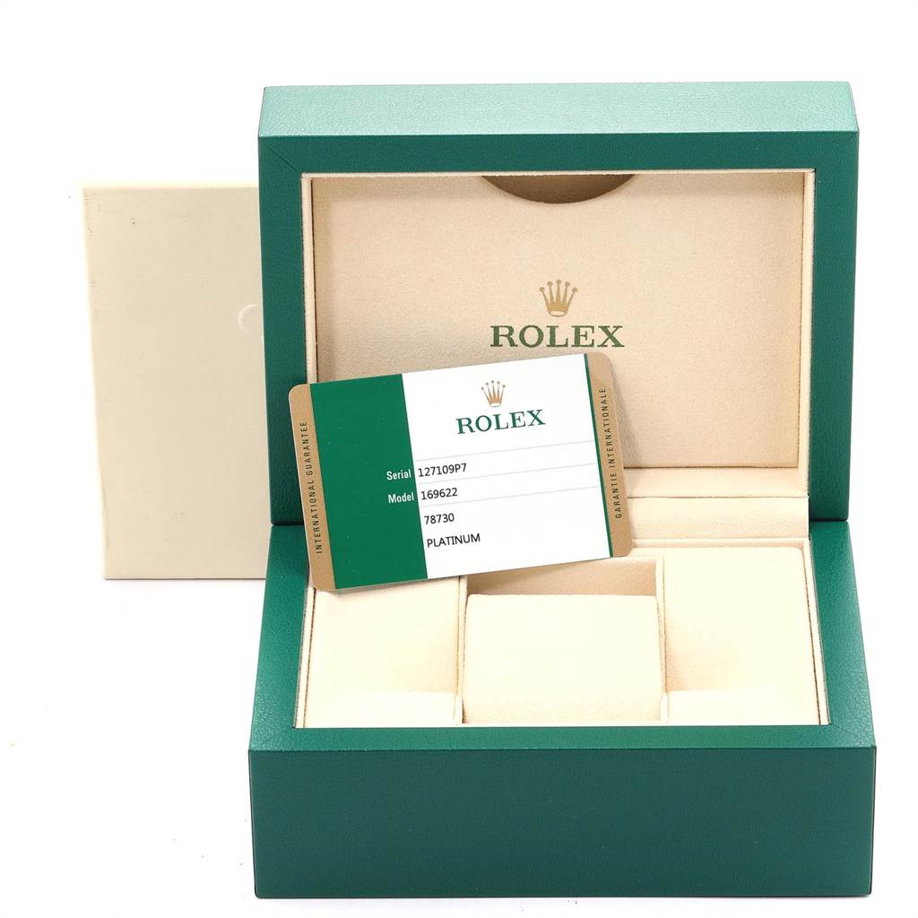 The image shows a green Rolex watch box with an international guarantee card for the Yacht-Master model.