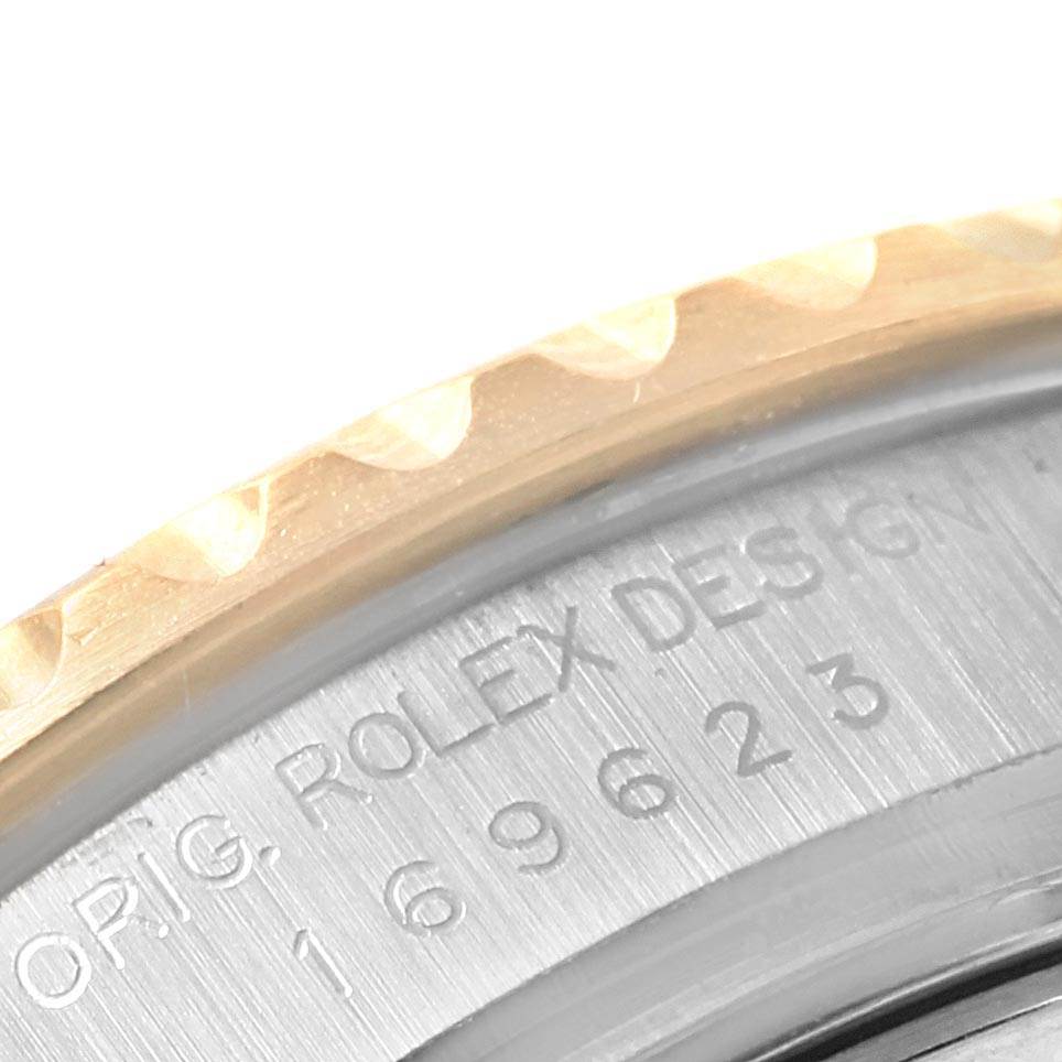This is a close-up angle of the engraved case back and part of the bezel of the Rolex Yacht-Master 169623 Women's Steel and Gold (two tone) White Dial 169623 Women's Steel and Gold (two tone) White Dial.