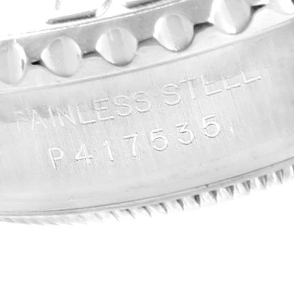 This close-up image of the Rolex Yacht-Master 169622 Women's Stainless Steel Silver Dial 169622 Women's Stainless Steel Silver Dial watch shows part of its stainless steel case and serial number engraving.