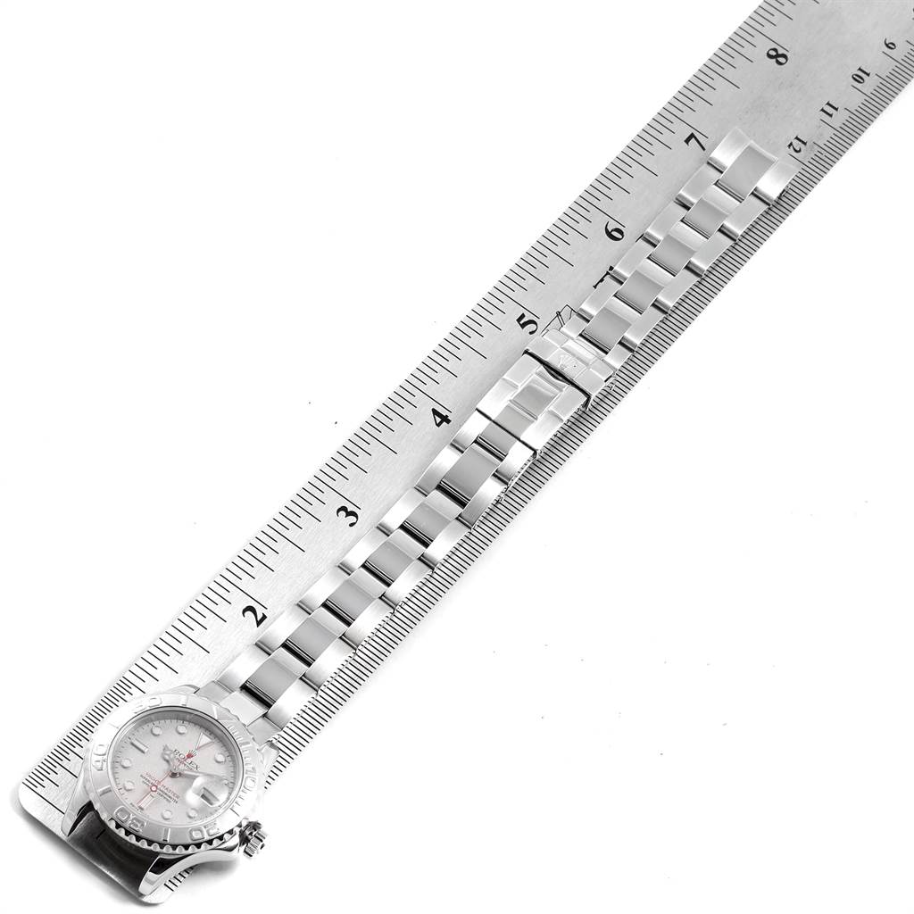 The image shows the Rolex Yacht-Master 169622 Women's Stainless Steel Silver Dial 169622 Women's Stainless Steel Silver Dial's face and metal bracelet measured against a ruler, photographed from above.