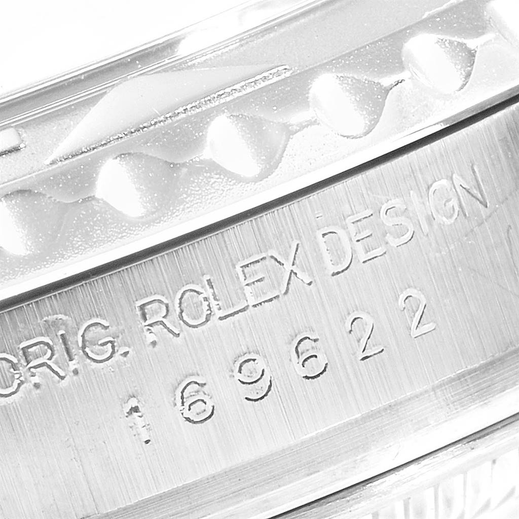 The image shows a close-up of the Rolex Yacht-Master 169622 Women's Stainless Steel Silver Dial 169622 Women's Stainless Steel Silver Dial's case, highlighting the brand engraving and model number.