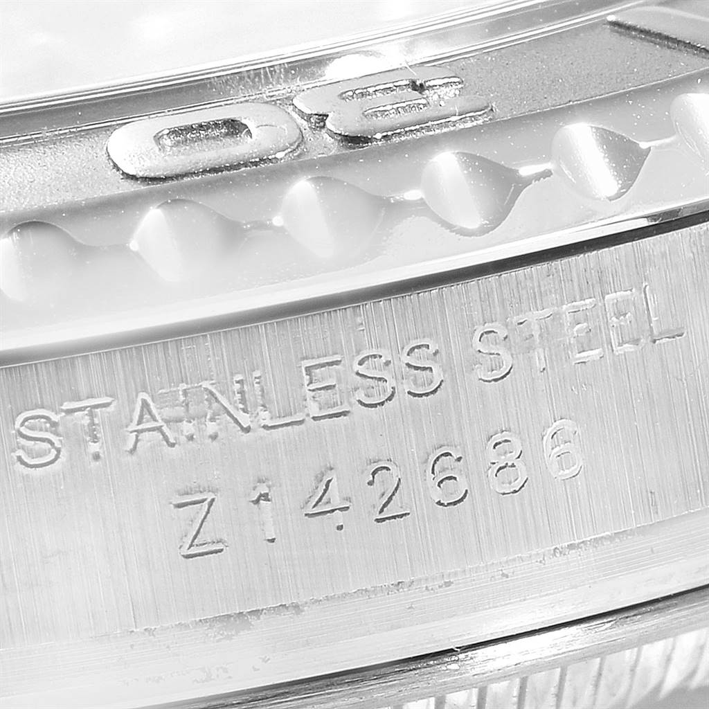 This image shows a close-up of the case side of a Rolex Yacht-Master 169622 Women's Stainless Steel Silver Dial 169622 Women's Stainless Steel Silver Dial watch, highlighting its stainless steel material and serial number.