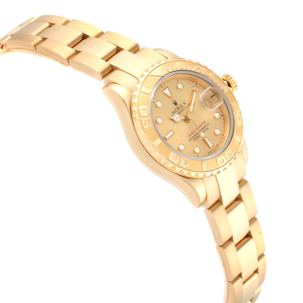 The image shows a side-view angle of a Rolex Yacht-Master 69628 Women's Yellow Gold Champagne Dial 69628 Women's Yellow Gold Champagne Dial watch, highlighting the bracelet, bezel, and dial.
