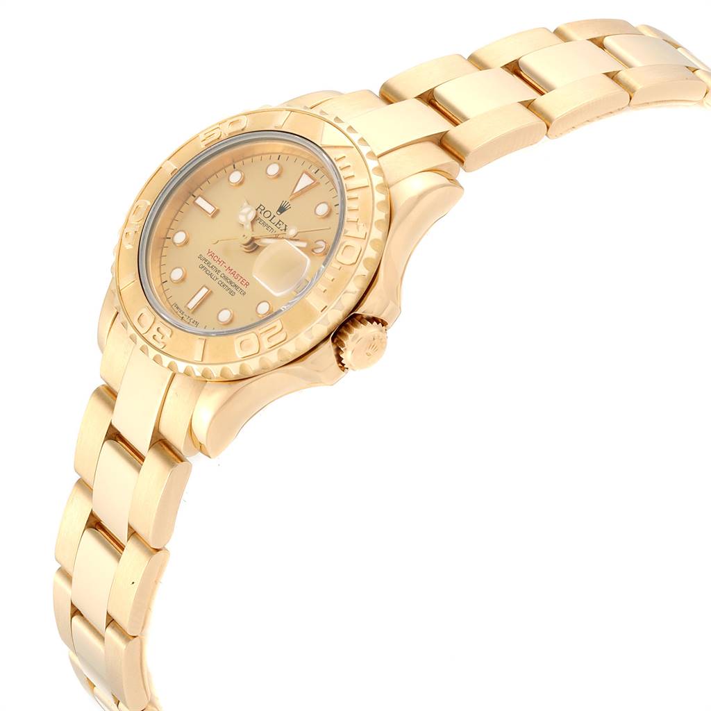 This image shows a Rolex Yacht-Master 69628 Women's Yellow Gold Champagne Dial 69628 Women's Yellow Gold Champagne Dial watch at an angled side view, highlighting the case, bezel, dial, crown, and bracelet.