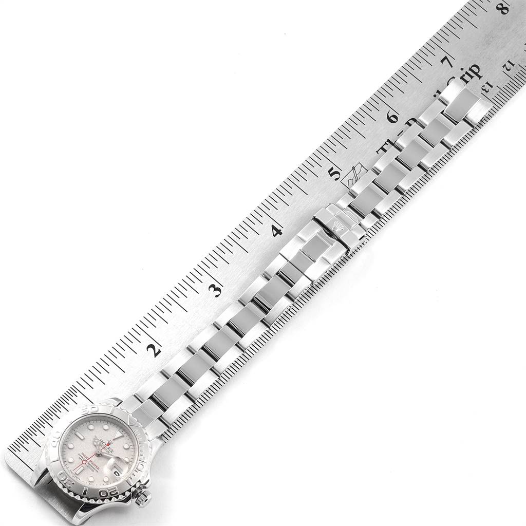 The image shows a Rolex Yacht-Master 169622 Women's Stainless Steel Silver Dial 169622 Women's Stainless Steel Silver Dial watch laid next to a ruler, displaying the bracelet and partially the face.