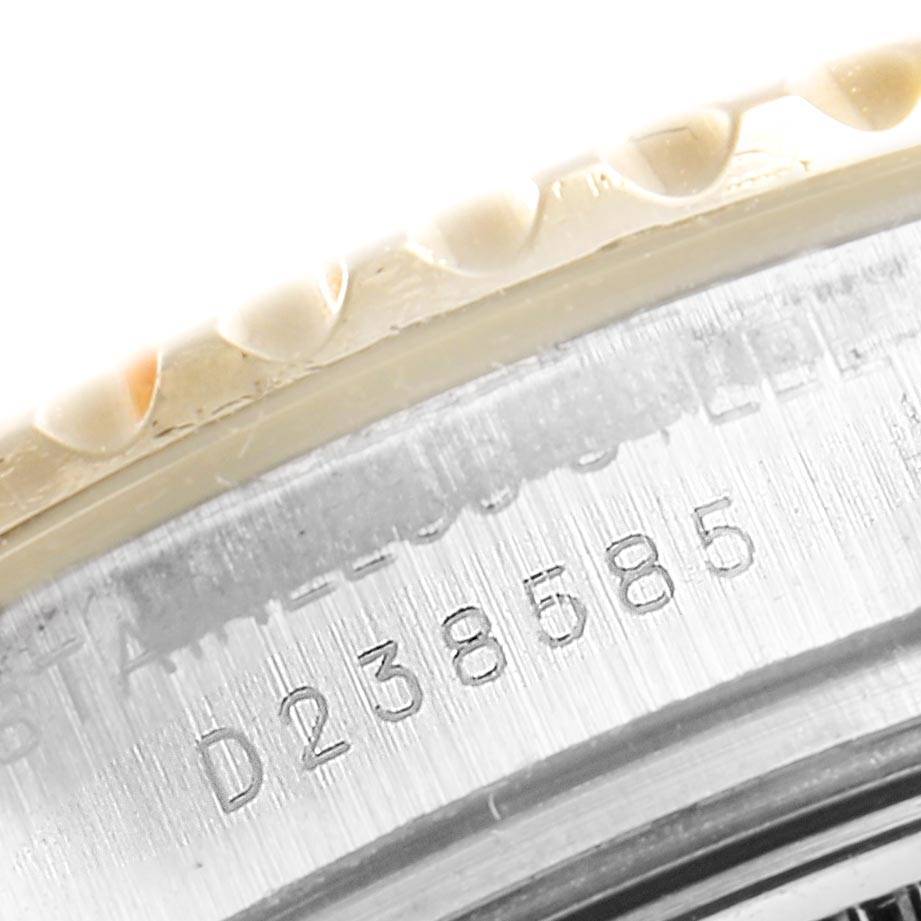 The image shows a close-up of the Rolex Yacht-Master 169623 Women's Steel and Gold (two tone) Mother of Pearl Dial 169623 Women's Steel and Gold (two tone) Mother of Pearl Dial watch, focusing on the engraved serial number and part of the bezel.