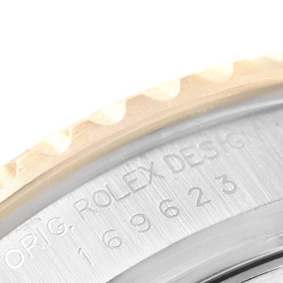 This partial image of a Rolex Yacht-Master 169623 Women's Steel and Gold (two tone) White Dial 169623 Women's Steel and Gold (two tone) White Dial watch shows the engraved bezel and part of the case back inscription.