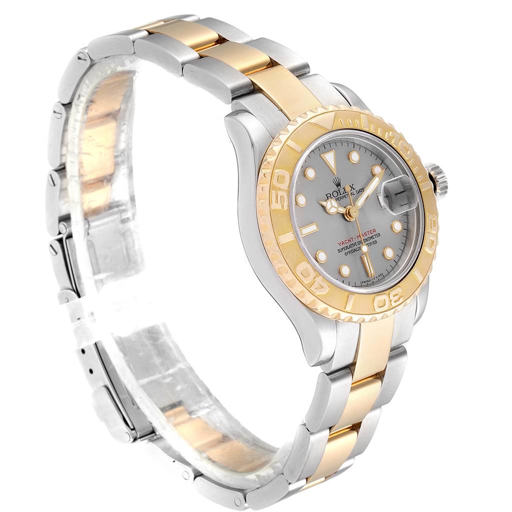 The image shows a side angle of the Rolex Yacht-Master 69623 Women's Steel and Gold (two tone) Grey Dial 69623 Women's Steel and Gold (two tone) Grey Dial watch featuring the dial, bezel, and part of the bracelet.