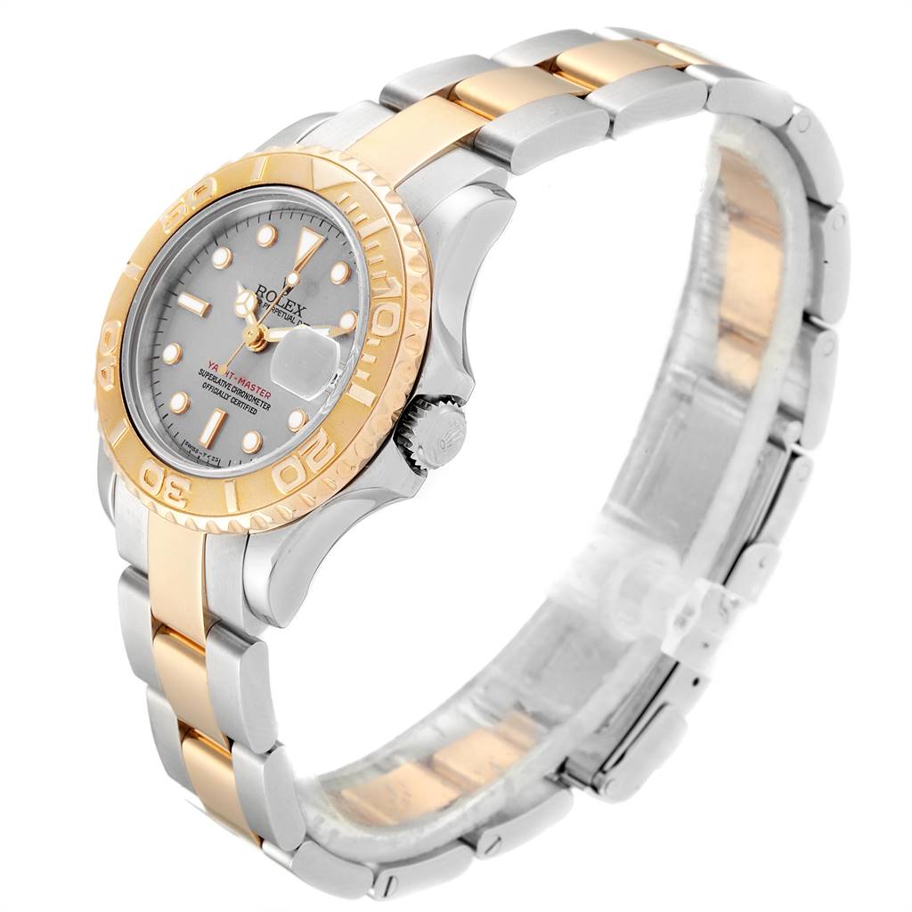 This image showcases a Rolex Yacht-Master 69623 Women's Steel and Gold (two tone) Grey Dial 69623 Women's Steel and Gold (two tone) Grey Dial watch at an angled position, displaying its bezel, dial, and two-tone bracelet.