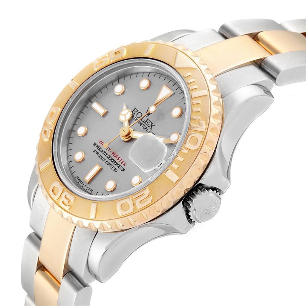 The image shows a side angle of the Rolex Yacht-Master 69623 Women's Steel and Gold (two tone) Grey Dial 69623 Women's Steel and Gold (two tone) Grey Dial watch, highlighting its two-tone bracelet, bezel, dial, and crown.