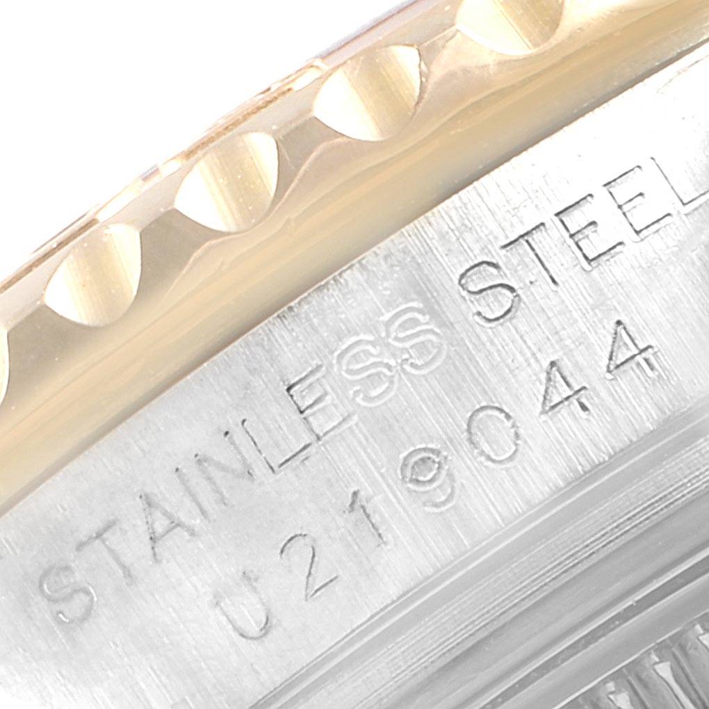 This close-up image showcases the edge of the stainless steel casing and part of the bezel of a Rolex Yacht-Master 69623 Women's Steel and Gold (two tone) White Dial 69623 Women's Steel and Gold (two tone) White Dial watch.